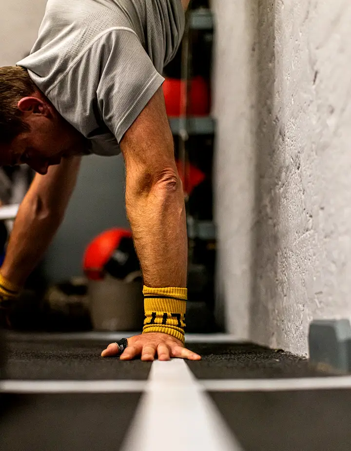 Athlete mid-air on a box jump